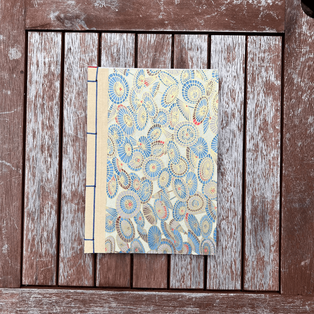 A5 Notebook — Gold umbrellas — Plain 90gsm paper